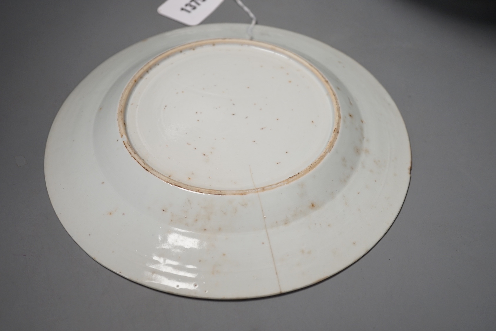 An 18th century Chinese blue and white punch bowl and similar plate. Largest 29cm
